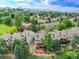 Aerial shot of townhouses surrounded by trees, showcasing a well-maintained neighborhood at 12658 W 1St Pl # 78, Denver, CO 80228