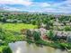 Aerial view of homes by a lake, featuring beautiful scenery and a peaceful neighborhood setting at 12658 W 1St Pl # 78, Denver, CO 80228