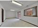 Open basement area featuring sliding doors to the outside and a window for natural light at 12658 W 1St Pl # 78, Denver, CO 80228