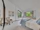 Bedroom features a large window seat with serene outdoor views at 12658 W 1St Pl # 78, Denver, CO 80228