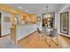 Open dining area with wood floors and a modern chandelier at 12658 W 1St Pl # 78, Denver, CO 80228