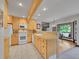 Cozy kitchen features light wood cabinets, recessed lighting, and a bright, functional design at 12658 W 1St Pl # 78, Denver, CO 80228