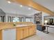 Kitchen overlooking the living room, featuring wood cabinets, and an open layout at 12658 W 1St Pl # 78, Denver, CO 80228