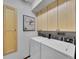 Laundry room features a washer, dryer, and storage cabinets at 12658 W 1St Pl # 78, Denver, CO 80228
