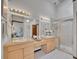 Bright main bathroom features dual sinks and a walk-in shower at 12658 W 1St Pl # 78, Denver, CO 80228