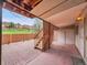 Covered brick patio with privacy lattice and steps to lawn area at 12658 W 1St Pl # 78, Denver, CO 80228
