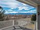 Covered back porch with expansive views of the mountains and surrounding landscape at 2472 W Peakview Ct, Littleton, CO 80120