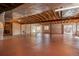 Expansive unfinished basement with exposed ceiling, concrete floor, and natural light at 2472 W Peakview Ct, Littleton, CO 80120