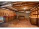 Storage space in the basement features wooden cabinets and countertops at 2472 W Peakview Ct, Littleton, CO 80120