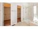 Bathroom featuring a glass shower and walk-in closets providing ample storage at 2472 W Peakview Ct, Littleton, CO 80120