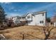 Back exterior view of home featuring multiple decks overlooking the backyard at 2472 W Peakview Ct, Littleton, CO 80120