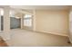 Open concept living room with high ceilings, exposed beams, and large windows at 2472 W Peakview Ct, Littleton, CO 80120