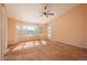 Spacious living room showcasing large windows that provide an abundance of natural light and views at 2472 W Peakview Ct, Littleton, CO 80120