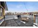 Outdoor kitchen and eating space on this building's rooftop patio at 500 E 11Th Ave # 401, Denver, CO 80203