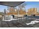 Outdoor rooftop with a view, seating, and a counter for entertaining at 500 E 11Th Ave # 401, Denver, CO 80203