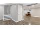 Finished basement with wood-look floors and white trim, and convenient storage at 801 S 15Th Ave, Brighton, CO 80601