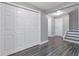 Basement area with vinyl floors, white walls, and access to stairs and doorways at 801 S 15Th Ave, Brighton, CO 80601