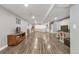 Spacious basement features wood-look flooring, storage, and ample natural light at 801 S 15Th Ave, Brighton, CO 80601