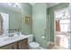 Charming bathroom with green walls, providing a clean and functional space with modern fixtures at 801 S 15Th Ave, Brighton, CO 80601