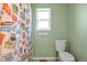 Bathroom featuring a shower with a unique shower curtain and tile flooring at 801 S 15Th Ave, Brighton, CO 80601