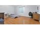 Spacious bedroom features wood-look floors, a sunny window, and room to work and relax at 801 S 15Th Ave, Brighton, CO 80601