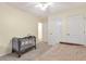 Bright bedroom features neutral carpeting and paint and two large closets at 801 S 15Th Ave, Brighton, CO 80601