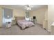 Bright bedroom with carpet flooring, ceiling fan, and study space at 801 S 15Th Ave, Brighton, CO 80601