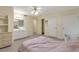 Bright bedroom featuring a ceiling fan and a vanity at 801 S 15Th Ave, Brighton, CO 80601