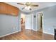 Bright bedroom with hardwood floors and ample closet space, offering a comfortable and functional living space at 801 S 15Th Ave, Brighton, CO 80601