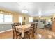 Inviting dining room features hardwood floors and seamless transition to the cozy living area and outdoor views at 801 S 15Th Ave, Brighton, CO 80601