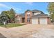 Charming two-story brick home with an attached two-car garage and a spacious driveway at 801 S 15Th Ave, Brighton, CO 80601