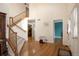 Bright foyer with hardwood floors, a staircase, and an open floor plan at 801 S 15Th Ave, Brighton, CO 80601