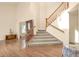 Bright foyer featuring beautiful hardwood floors, stairs to the second floor, and high ceilings at 801 S 15Th Ave, Brighton, CO 80601