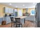Stylish kitchen with stainless steel appliances, a center island, and wood-look floors at 801 S 15Th Ave, Brighton, CO 80601
