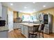 Modern kitchen with stainless steel appliances, a butcher block island, and granite countertops at 801 S 15Th Ave, Brighton, CO 80601