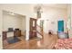 Bright open-concept living room with hardwood floors, high ceilings, and plenty of natural light at 801 S 15Th Ave, Brighton, CO 80601