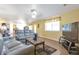 Open-concept living room filled with natural light, seamlessly connecting to the kitchen and dining area at 801 S 15Th Ave, Brighton, CO 80601
