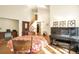 Open-concept living room with wood floors, high ceilings, and a piano at 801 S 15Th Ave, Brighton, CO 80601