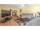 Comfortable living room boasts a fireplace, hardwood floors, and ample seating, perfect for relaxation at 801 S 15Th Ave, Brighton, CO 80601