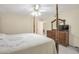 Comfortable bedroom featuring a four-poster bed, ceiling fan, and wood dresser at 801 S 15Th Ave, Brighton, CO 80601