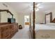 Spacious bedroom with neutral carpet, ceiling fan, and a dark wood dresser with a TV at 801 S 15Th Ave, Brighton, CO 80601