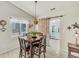 Bright dining room with table and chairs, access to sunroom and pool at 4201 Beautiful Cir, Castle Rock, CO 80109