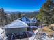 Aerial view of home showcasing three-car garage at 25060 Montane Drive West, Golden, CO 80401