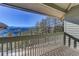 Deck with mountain views and a wooden railing at 25060 Montane Drive West, Golden, CO 80401