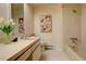 Bathroom with shower/tub combo and a geometric design at 25060 Montane Drive West, Golden, CO 80401