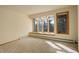 Bedroom with large windows offering mountain views at 25060 Montane Drive West, Golden, CO 80401