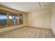 Bright bedroom with mountain views and carpeted floor at 25060 Montane Drive West, Golden, CO 80401