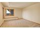 Simple bedroom with window and carpet at 25060 Montane Drive West, Golden, CO 80401