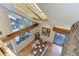 High-ceilinged dining room with a wooden table and access to a deck at 25060 Montane Drive West, Golden, CO 80401