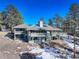 Two-story home with deck and mountain views at 25060 Montane Drive West, Golden, CO 80401